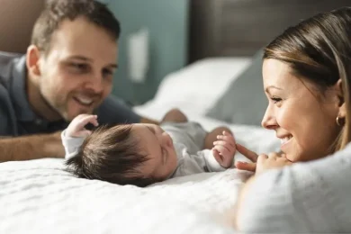 Couple looking at their baby during their donor egg parenthood journey